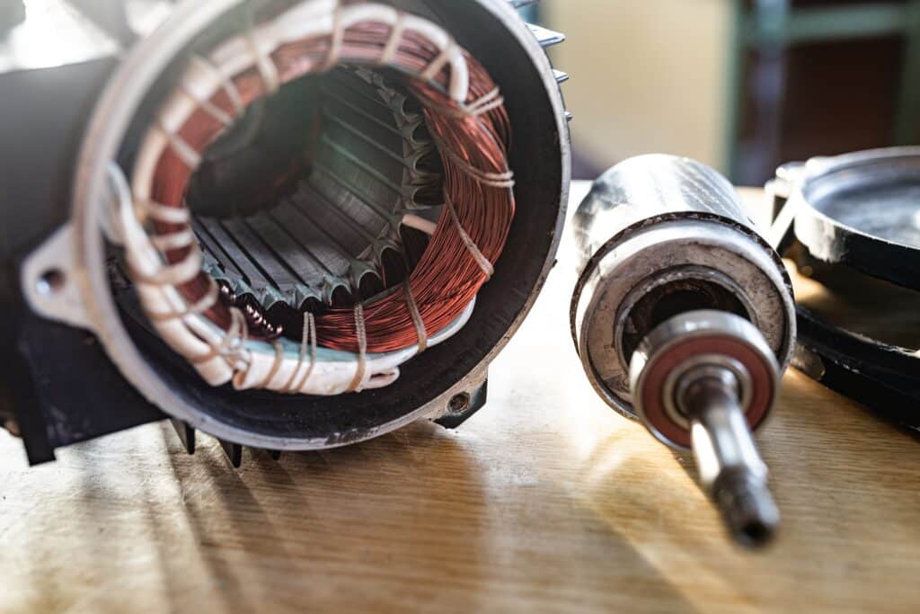 Close-up of a disassembled metal motor with wire